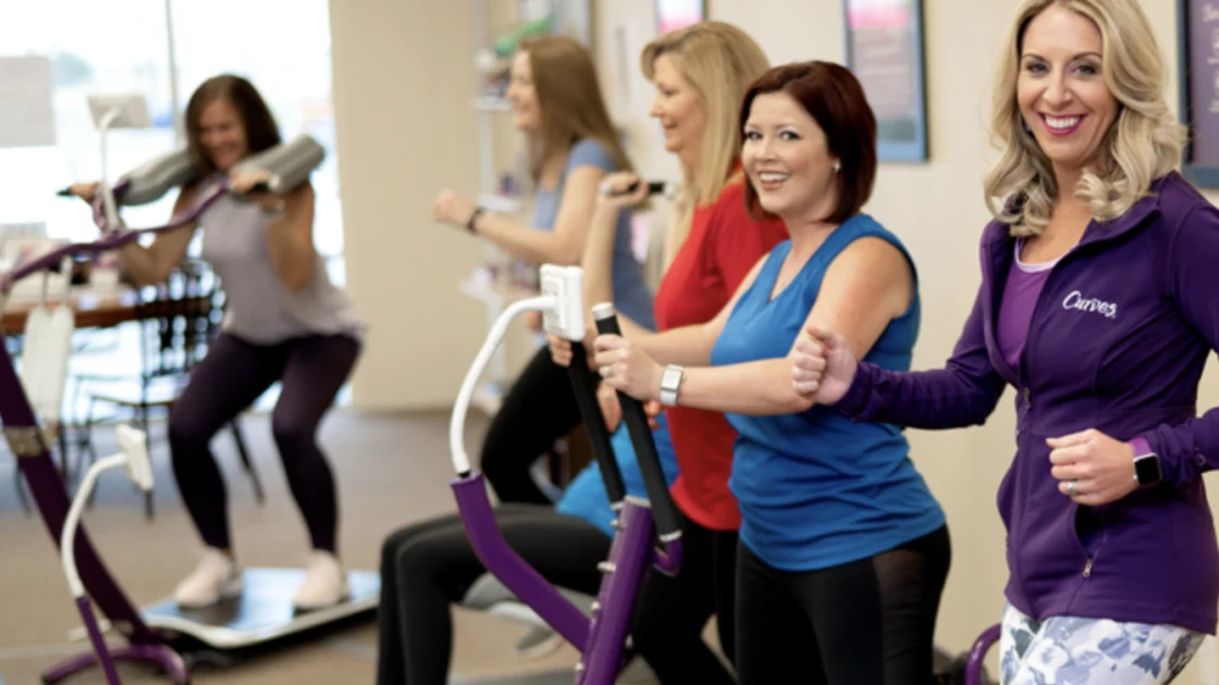 a group of women work out at a Curves gym